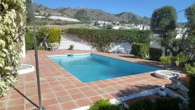 Large luxury villa for sale set in mature walled garden in Nerja, Málaga