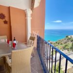 Impeccable apartment with sea and mountain views, parking, and pool for sale in La Herradura